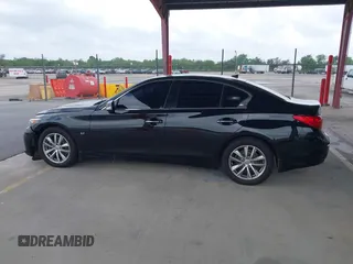 2015 Infiniti Q50 Premium with VIN JN1BV7AR1FM390739, listed as a IAAI auction lot 41865581 with 172,326 mi miles and . Bid and sale history available at DreamBid. Image 14.