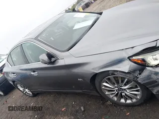 2019 Infiniti Q50 Luxe z VIN JN1EV7AP5KM518681, wystawiony jako IAAI lot #41958746 z przebiegiem 66 629 mil mil oraz . Historia ofert i sprzedaży dostępna na DreamBid. Obrazek 13.