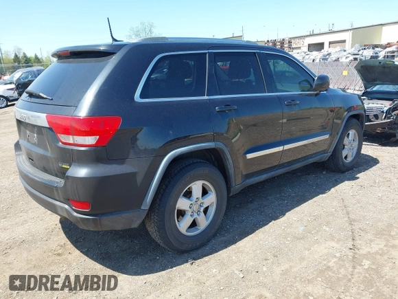 2011 Jeep Grand Cherokee Laredo with VIN 1J4RR4GGXBC546727, listed as a IAAI auction lot 42232520 with 268,616 mi miles and . Bid and sale history available at DreamBid. Image 4.