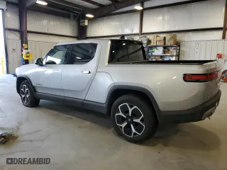 2022 Rivian R1T Adventure Package with VIN 7FCTGAAA4NN014462, listed as a Copart auction lot 73310644 with 89 mi miles and Salvage Title. Bid and sale history available at carsss.com. Image 2.