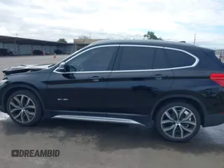 2017 BMW X1 sDrive28i with VIN WBXHU7C3XHP924635, listed as a IAAI auction lot 41744824 with 74,143 mi miles. Bid and sale history available at carsss.com. Image 14.
