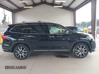 2021 Honda Pilot Elite with VIN 5FNYF6H04MB043014, listed as a IAAI auction lot 41826931 with 63,546 mi miles and . Bid and sale history available at DreamBid. Image 13.