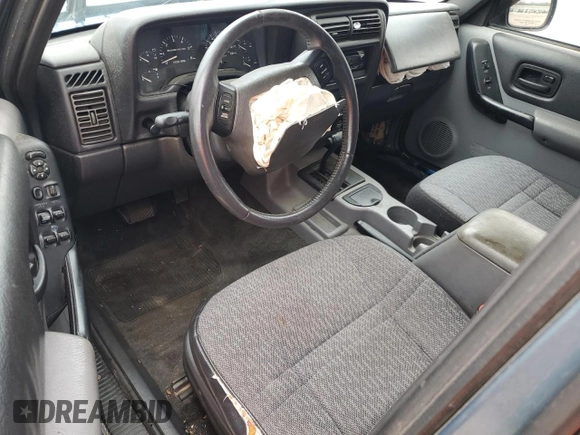 1999 Jeep Cherokee Sport с VIN 1J4FT68S9XL552299, выставлен на аукционе Copart как лот 58045135 с пробегом Не указан миль и Списание • Salvage title. История ставок и продаж доступна на DreamBid. Изображение 8.