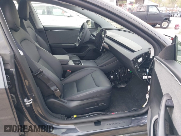 2025 Tesla Model 3 Long Range with VIN 5YJ3E1EA5SF890621, listed as a IAAI auction lot 41924915 with 6,528 mi miles and . Bid and sale history available at DreamBid. Image 5.
