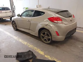 2013 Hyundai Veloster w/Black Int with VIN KMHTC6AD2DU128534, listed as a IAAI auction lot 41791398 with 158,414 mi miles and . Bid and sale history available at DreamBid. Image 3.