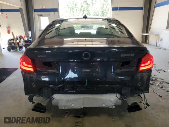 2018 BMW 5 Series 540i xDrive with VIN WBAJE7C56JWC57314, listed as a Copart auction lot 60610715 with 73,015 mi miles and Salvage title. Bid and sale history available at DreamBid. Image 6.