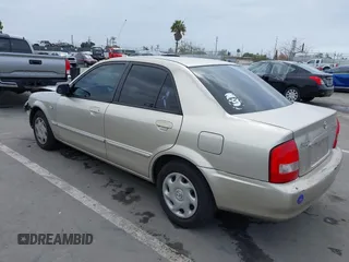 2002 Mazda Protege DX with VIN JM1BJ225121620394, listed as a IAAI auction lot 42043056 with 187,360 mi miles and . Bid and sale history available at DreamBid. Image 3.