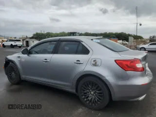 2011 Suzuki Kizashi SE z VIN JS2RE9A3XB6111196, wystawiony jako Copart lot #48076635 z przebiegiem 113 569 mil mil oraz Szkody całkowita. Historia ofert i sprzedaży dostępna na DreamBid. Obrazek 2.