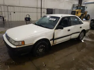 1988 Mazda 626 z VIN JM1GD2225J1533700, wystawiony jako Copart lot #45902395 z przebiegiem 186 663 mil mil oraz Szkoda całkowita • Salvage title. Historia ofert i sprzedaży dostępna na DreamBid. Obrazek 1.