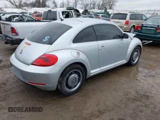 2012 Volkswagen Beetle 2.5L PZEV with VIN 3VWJP7ATXCM601206, listed as a IAAI auction lot 41733311 with 111,742 mi miles. Bid and sale history available at carsss.com. Image 4.
