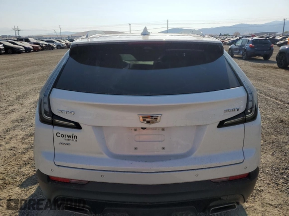 2021 Cadillac XT4 AWD Sport with VIN 1GYFZFR43MF032608, listed as a Copart auction lot 74906524 with 55,751 mi miles and Salvage title. Bid and sale history available at DreamBid. Image 6.
