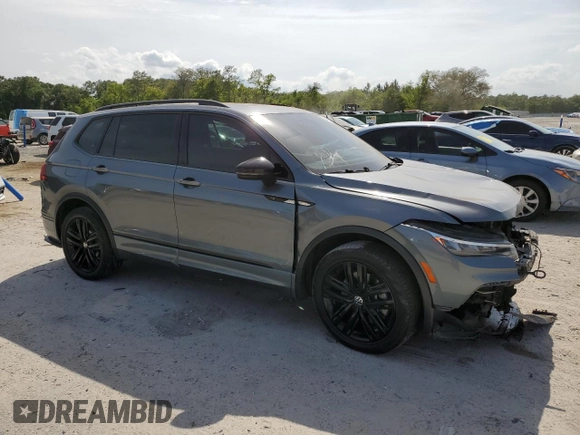 2022 Volkswagen Tiguan SE R-Line Black with VIN 3VVCB7AX6NM081880, listed as a Copart auction lot 54102735 with 52,010 mi miles and Salvage Title. Bid and sale history available at DreamBid. Image 4.