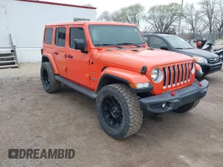 2020 Jeep Wrangler Unlimited Sahara with VIN 1C4HJXENXLW231194, listed as a IAAI auction lot 42083147 with 34,166 mi miles. Bid and sale history available at carsss.com. Image 1.