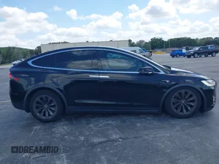 2017 Tesla Model X 90D with VIN 5YJXCBE21HF054898, listed as a IAAI auction lot 42076462 with 89,996 mi miles and . Bid and sale history available at DreamBid. Image 12.