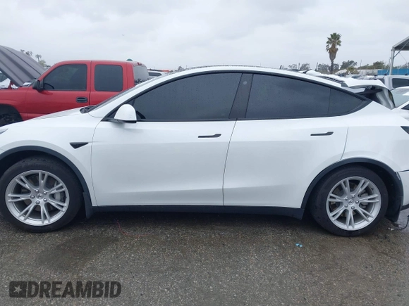 2021 Tesla Model Y Long Range with VIN 5YJYGAEE2MF260142, listed as a IAAI auction lot 41808666 with 87,316 mi miles and . Bid and sale history available at DreamBid. Image 13.