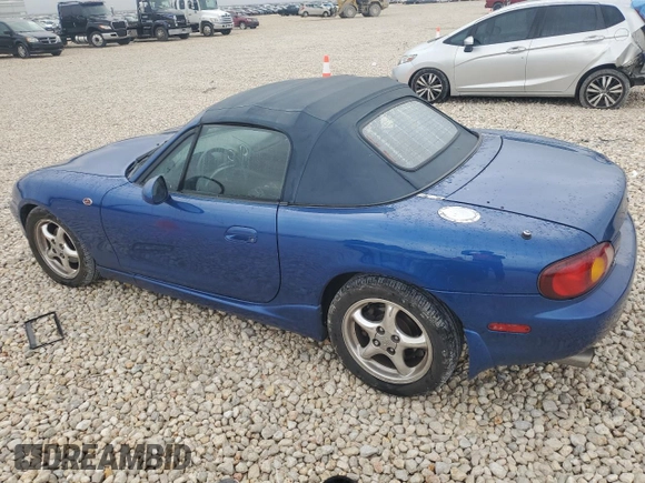1999 Mazda MX-5 Miata with VIN JM1NB3532X0134801, listed as a Copart auction lot 83838374 with 97,015 mi miles and Salvage title. Bid and sale history available at DreamBid. Image 2.