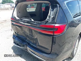 2023 Chrysler Pacifica Touring L with VIN 2C4RC1BG1PR606504, listed as a IAAI auction lot 42647652 with 41,598 mi miles and . Bid and sale history available at DreamBid. Image 6.