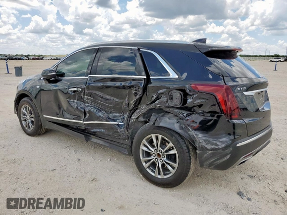 2021 Cadillac XT5 FWD Premium Luxury with VIN 1GYKNCRS0MZ100515, listed as a Copart auction lot 62856785 with 50,298 mi miles and Salvage title. Bid and sale history available at DreamBid. Image 2.
