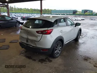 2016 Mazda CX-3 Grand Touring z VIN JM1DKBD71G0126151, wystawiony jako IAAI lot #42215837 z przebiegiem 81 349 mil mil oraz . Historia ofert i sprzedaży dostępna na DreamBid. Obrazek 4.