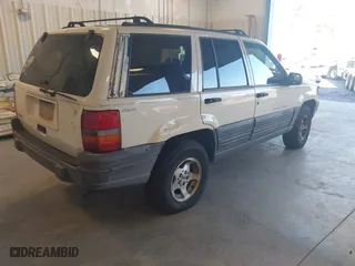 1997 Jeep Grand Cherokee Laredo with VIN 1J4GZ58SXVC552435, listed as a IAAI auction lot 41977888 with 143,832 mi miles. Bid and sale history available at carsss.com. Image 4.