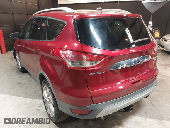 2014 Ford Escape Titanium with VIN 1FMCU9J9XEUD69589, listed as a IAAI auction lot 42031882 with 123,632 mi miles and . Bid and sale history available at DreamBid. Image 3.