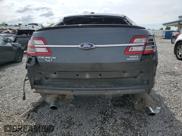 2015 Ford Taurus SEL z VIN 1FAHP2E89FG177287, wystawiony jako Copart lot #56074615 z przebiegiem 196 421 mil mil oraz Szkoda całkowita • Salvage title. Historia ofert i sprzedaży dostępna na DreamBid. Obrazek 6.