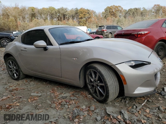 2023 Mazda MX-5 Miata Grand Touring with VIN JM1NDAM70P0552860, listed as a Copart auction lot 79240314 with 16,173 mi miles and Salvage title. Bid and sale history available at DreamBid. Image 4.
