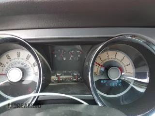 2010 Ford Mustang V6 with VIN 1ZVBP8AN3A5133074, listed as a Copart auction lot 52142895 with 124,033 mi miles and Salvage Title. Bid and sale history available at DreamBid. Image 9.