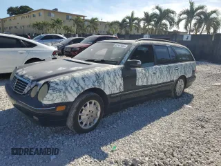 2001 Mercedes-Benz E-Class AWD with VIN WDBJH82J91X053532, listed as a Copart auction lot 82387664 with 116,737 mi miles and Salvage Title. Bid and sale history available at carsss.com. Image 1.