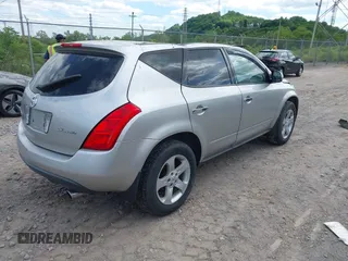 2003 Nissan Murano SE z VIN JN8AZ08W43W214000, wystawiony jako IAAI lot #42274384 z przebiegiem 98 927 mil mil oraz . Historia ofert i sprzedaży dostępna na DreamBid. Obrazek 4.