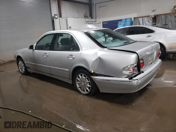 2000 Mercedes-Benz E-Class with VIN WDBJF82J1YX030388, listed as a Copart auction lot 86384974 with 212,596 mi miles and Salvage Title. Bid and sale history available at carsss.com. Image 2.
