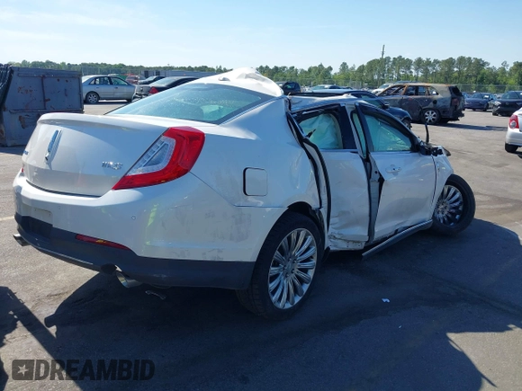 2014 Lincoln MKS with VIN 1LNHL9DK2EG612009, listed as a IAAI auction lot 39278558 with 56,893 mi miles. Bid and sale history available at carsss.com. Image 4.