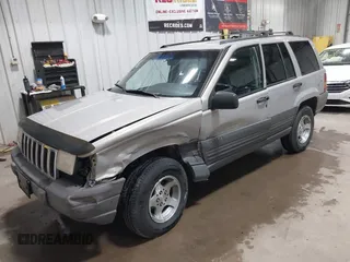1996 Jeep Grand Cherokee Laredo z VIN 1J4GZ58S5TC293897, wystawiony jako IAAI lot #42435233 z przebiegiem 167 432 mil mil oraz . Historia ofert i sprzedaży dostępna na DreamBid. Obrazek 17.