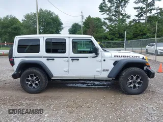 2021 Jeep Wrangler Unlimited Rubicon with VIN 1C4JJXFM9MW774142, listed as a IAAI auction lot 42625007 with 42,318 mi miles and . Bid and sale history available at DreamBid. Image 13.