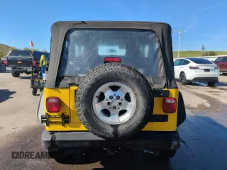 2004 Jeep Wrangler Sport z VIN 1J4FA49S64P751615, wystawiony jako Copart lot #55810895 z przebiegiem 128 165 mil mil oraz Szkoda całkowita • Salvage title. Historia ofert i sprzedaży dostępna na DreamBid. Obrazek 6.