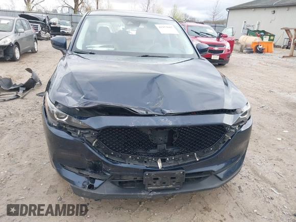 2017 Mazda CX-5 Touring with VIN JM3KFBCL7H0120552, listed as a IAAI auction lot 41953685 with 88,416 mi miles. Bid and sale history available at carsss.com. Image 6.