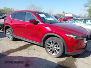2021 Mazda CX-5 Grand Touring with VIN JM3KFBDM8M1390188, listed as a IAAI auction lot 42000444 with 84,908 mi miles. Bid and sale history available at carsss.com. Image 1.