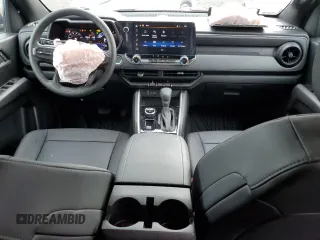 2024 Chevrolet Colorado 4WD Trail Boss with VIN 1GCPTEEK5R1271947, listed as a Copart auction lot 61806975 with 7,454 mi miles and Salvage title. Bid and sale history available at DreamBid. Image 8.