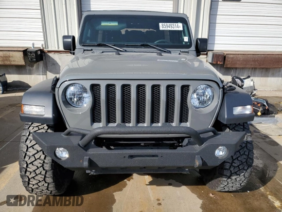 2023 Jeep Wrangler Sport S with VIN 1C4HJXDG8PW675134, listed as a Copart auction lot 85949314 with 19,128 mi miles and Salvage Title. Bid and sale history available at DreamBid. Image 5.