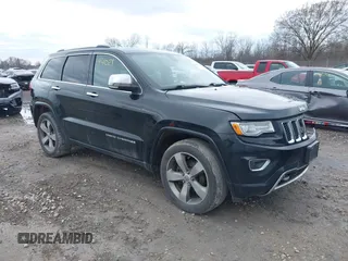 2014 Jeep Grand Cherokee Overland with VIN 1C4RJFCG5EC587396, listed as a IAAI auction lot 42094021 with 207,856 mi miles and . Bid and sale history available at DreamBid. Image 1.