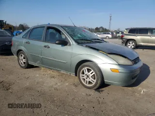 2004 Ford Focus SE with VIN 1FAFP34314W127053, listed as a Copart auction lot 48652265 with 241,841 mi miles and Salvage title. Bid and sale history available at DreamBid. Image 4.