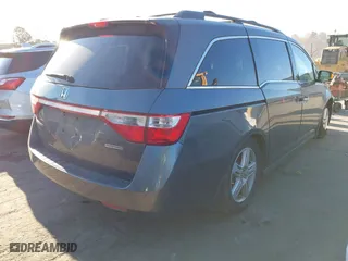 2013 Honda Odyssey Touring with VIN 5FNRL5H9XDB009973, listed as a IAAI auction lot 41904710 with 219,067 mi miles. Bid and sale history available at carsss.com. Image 4.