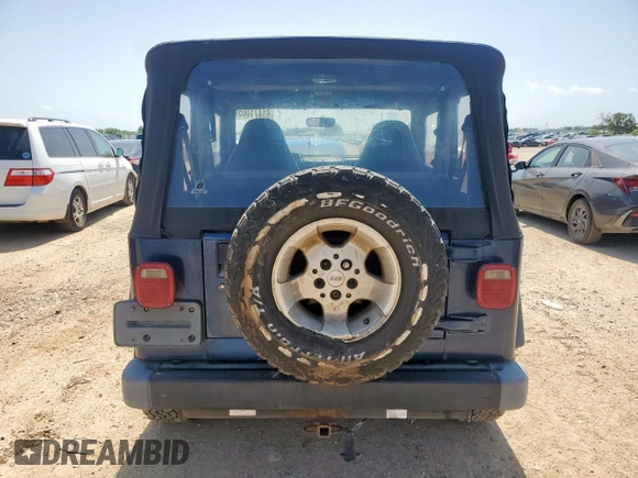 2000 Jeep Wrangler Sport with VIN 1J4FA49S9YP742414, listed as a Copart auction lot 61471065 with 139,572 mi miles and Clean title. Bid and sale history available at DreamBid. Image 6.
