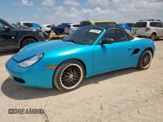 2000 Porsche Boxster z VIN WP0CA2987YU625093, wystawiony jako Copart lot #61354785 z przebiegiem 105 045 mil mil oraz Czysty tytuł • Clean title. Historia ofert i sprzedaży dostępna na DreamBid. Obrazek 1.