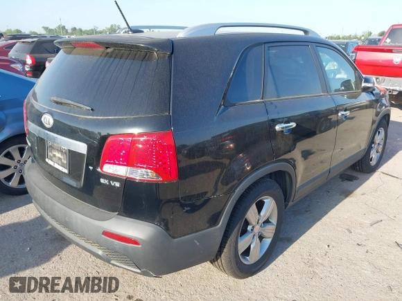 2012 Kia Sorento EX with VIN 5XYKU4A28CG206217, listed as a IAAI auction lot 42009504 with 205,522 mi miles. Bid and sale history available at carsss.com. Image 4.