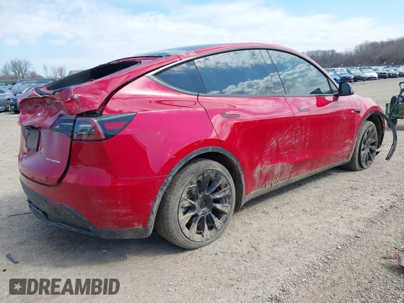 2023 Tesla Model Y Long Range with VIN 7SAYGDEE6PA157652, listed as a IAAI auction lot 41866777 with 22,584 mi miles. Bid and sale history available at carsss.com. Image 4.