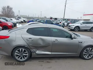 2014 Kia Optima SXL Turbo with VIN 5XXGR4A69EG312273, listed as a IAAI auction lot 41729863 with 107,660 mi miles and . Bid and sale history available at DreamBid. Image 13.