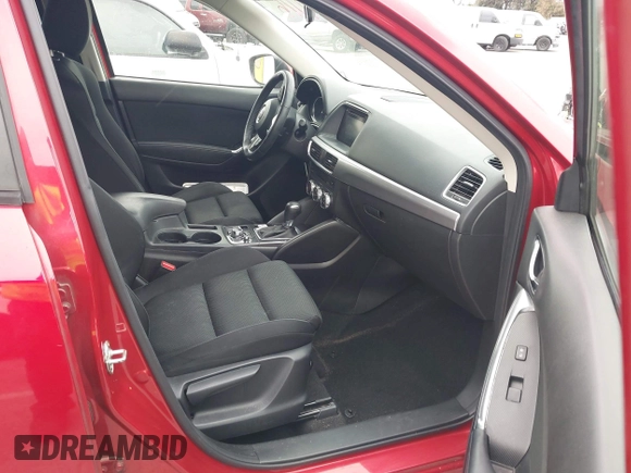 2016 Mazda CX-5 Touring with VIN JM3KE2CY3G0877185, listed as a IAAI auction lot 41729243 with 144,656 mi miles. Bid and sale history available at carsss.com. Image 5.