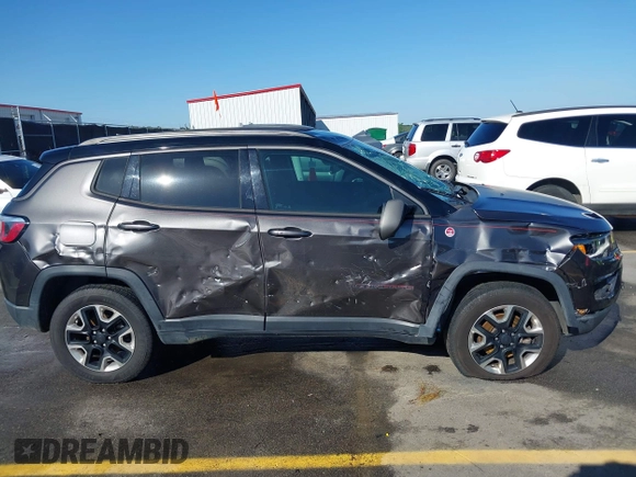 2018 Jeep Compass Trailhawk with VIN 3C4NJDDB3JT231923, listed as a IAAI auction lot 41929198 with 129,001 mi miles and . Bid and sale history available at carsss.com. Image 13.