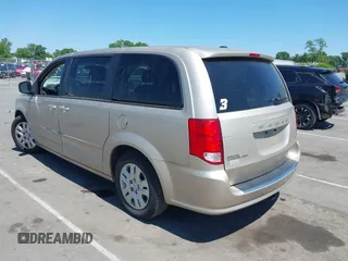 2015 Dodge Grand Caravan American Value with VIN 2C4RDGBG3FR647957, listed as a IAAI auction lot 42147813 with 129,859 mi miles and . Bid and sale history available at DreamBid. Image 3.